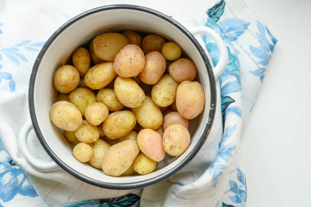 istock Boiled potatoes in their skins in a saucepan 1168457774
