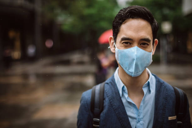 istock Businessman in Taipei wearing protective face-mask 1168460176