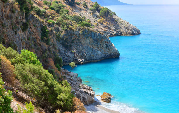 istock Greek style seascape with mediterranean sea and rocks 1168464722