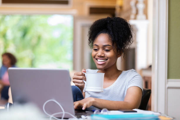 istock Cheerful woman using laptop 1168467091