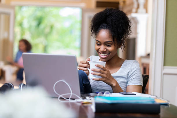 istock Woman smiles during video conference 1168467092