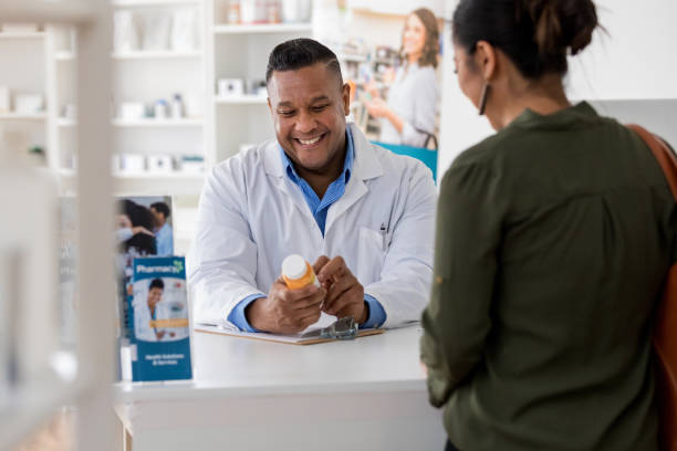 istock Customer shares laugh with pharmacist 1168467256