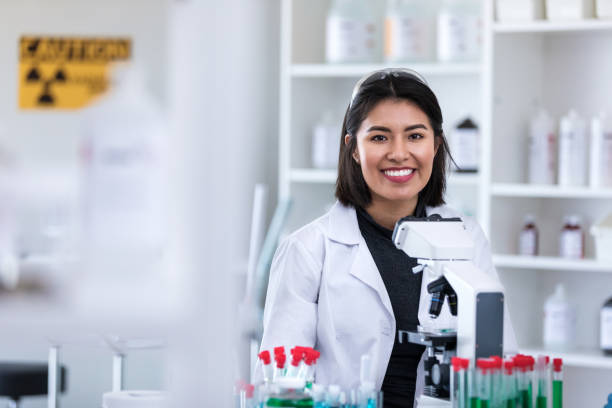 istock Smiling mid adult female scientist 1168467517