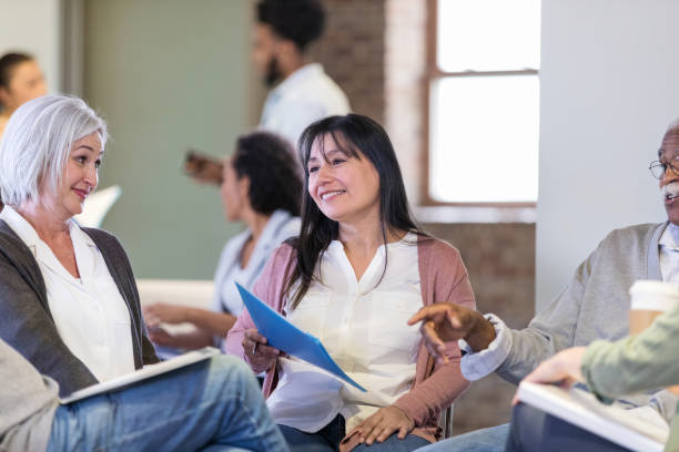 istock Lively discussion among homeowners at meeting 1168467739