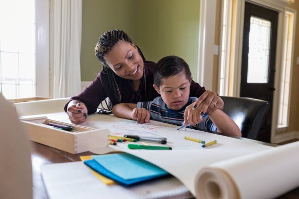 istock Mom helps her special needs son 1168468419