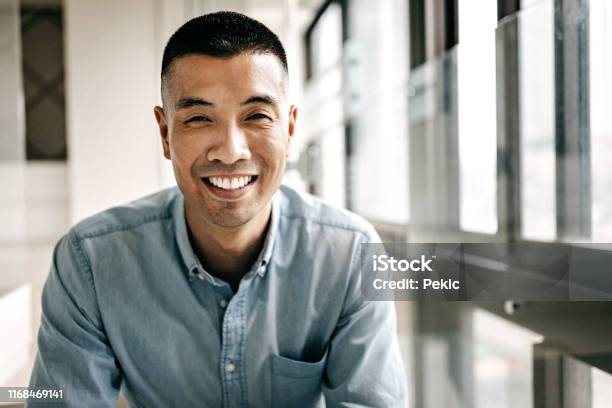 Portrait Of Handsome Young Taiwanese Man Stock Photo - Download Image Now - Men, Portrait, Smiling