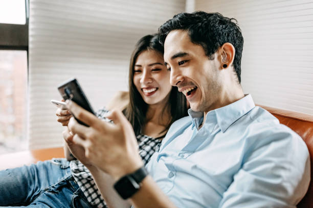 Couple Working Together Online Young Creative Couple Working Together Online taiwan people stock pictures, royalty-free photos & images