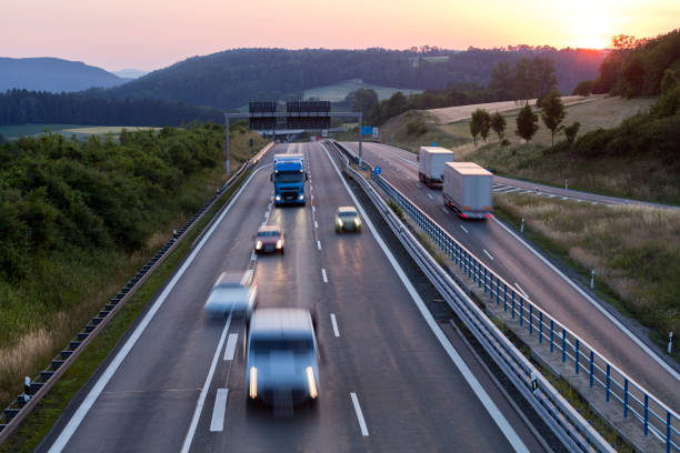 istock Semi Truck Speeding on Highway at Sunset, Germany 1168469384
