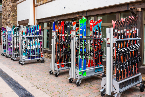 Vail, USA - June 29, 2019: Vacation town in Colorado with store shops and snowboard ski rack