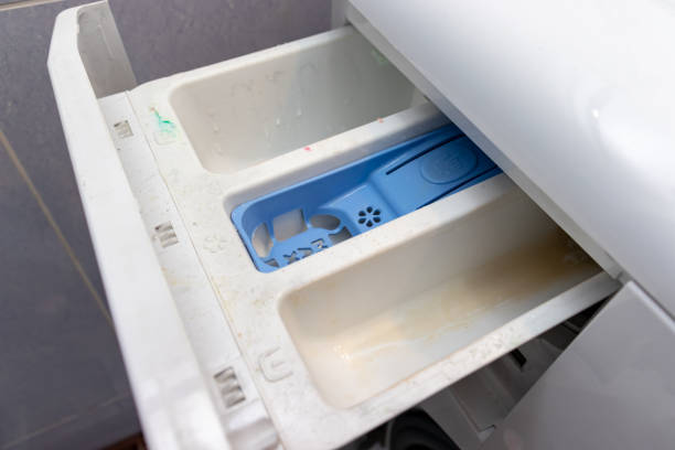 dirty moldy washing machine detergent and fabric conditioner dispenser drawer compartment close up. mold, rust and limescale in washing machine tray. home appliances periodic maintenance - water pipe rusty dirty equipment imagens e fotografias de stock