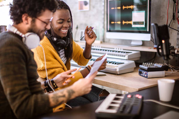 working on their new music project in studio - headphones women tattoo music imagens e fotografias de stock