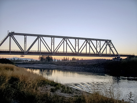 Railway bridge across the river. Steel construction