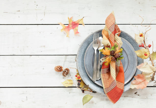 Autumn Thanksgiving Place Setting Autumn holiday Thanksgiving dining place setting on an old wood table place setting table plate dining table stock pictures, royalty-free photos & images