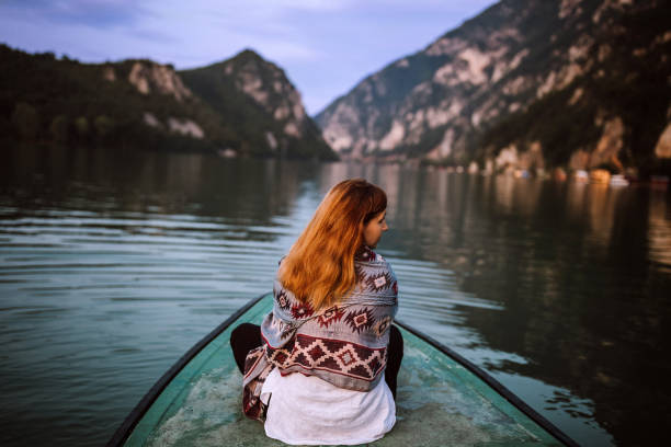 istock Enjoying in view on small boat on lake 1168484660