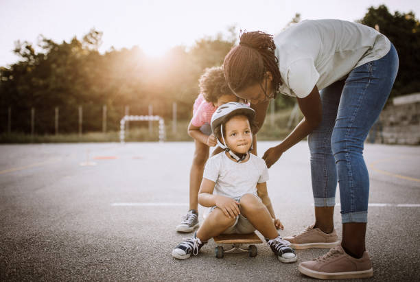 istock Little African girl having fun on skateboard 1168485403