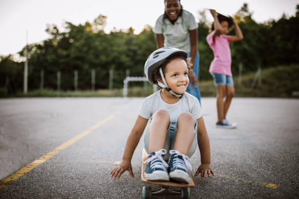 istock Little African girl having fun on skateboard 1168485414