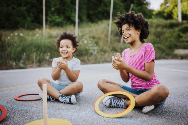 istock Sisters playing Stick and hoop game 1168486092