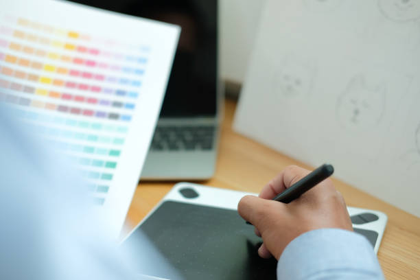 istock artist graphic designer drawing artwork. creative design workplace 1168489415