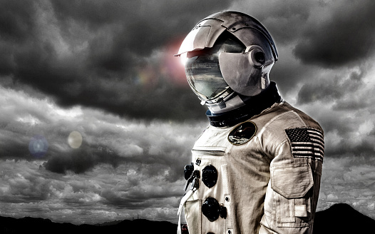Spaceman on dark cloud background.