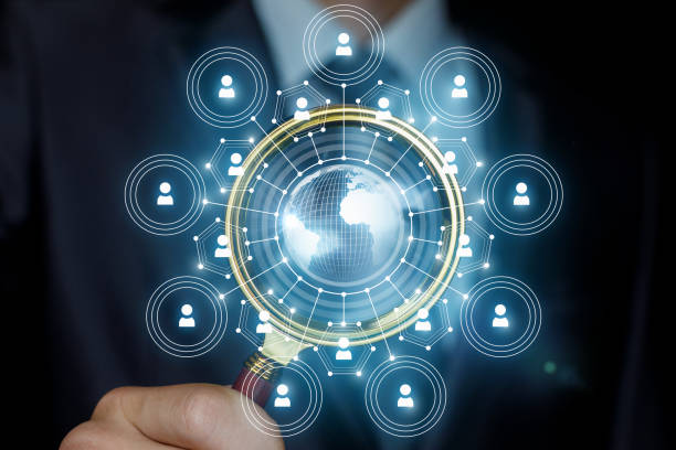 istock Businessman analyzes the business network with a magnifying glass. 1168490566
