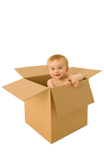 istock Baby emerges from a cardboard box 116849415