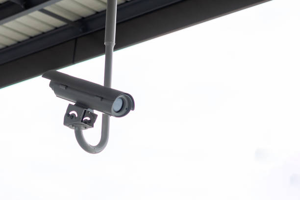 istock Modern Security Camera with office or buildings background, cctv to record and property protection for dangerous and car park 1168495567