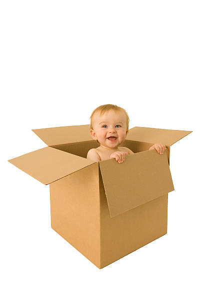 istock Baby emerges from a cardboard box 116849623