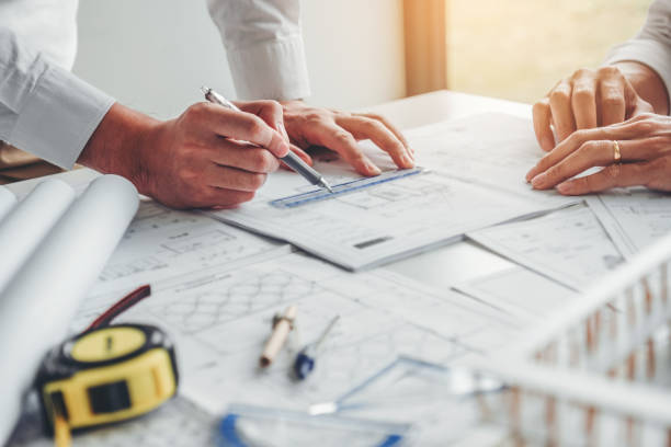 istock Team Engineer drawing graphic planning and meeting for architectural project on workplace 1168504041