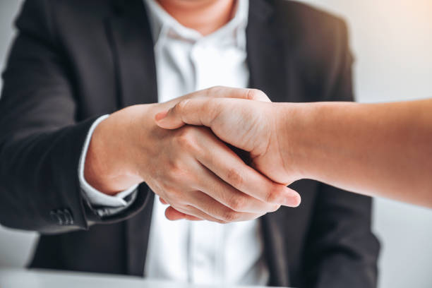 istock Business team shaking hands during a meeting Planning Strategy Analysis Concept 1168504051