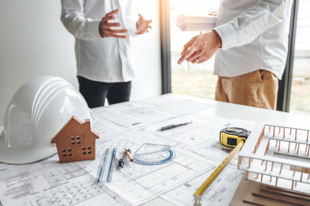 istock Team Engineer drawing graphic planning and meeting for architectural project on workplace 1168504062