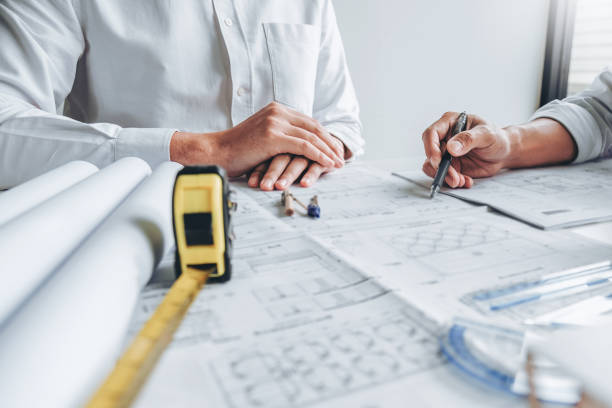Team Engineer drawing graphic planning and meeting for architectural project on workplace