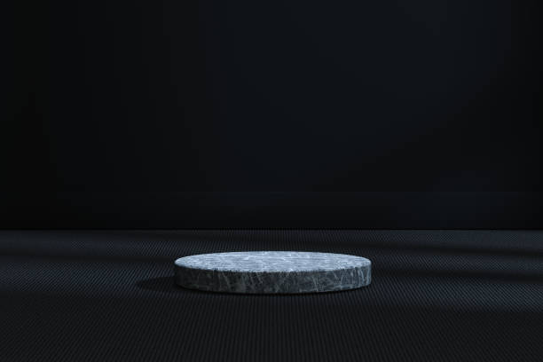 istock The marble cylinder platform in the dark room, 3d rendering. 1168504201