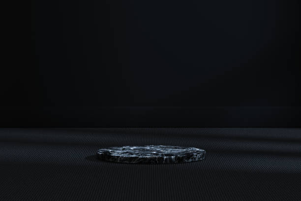 istock The marble cylinder platform in the dark room, 3d rendering. 1168504213