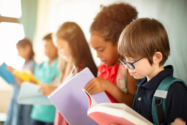 istock Group of diverse young students studying in  classroom 1168505078