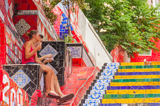 September 20, 2018 - Rio de Janeiro, Brazil: Tourists enjoying the colorful Escadaria Selaron Stairs stairway in Rio de Janeiro, Brazil.