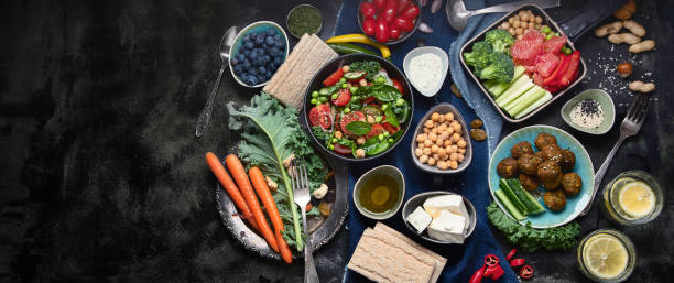 istock Vegetarian variety dishes on black background. 1168509842