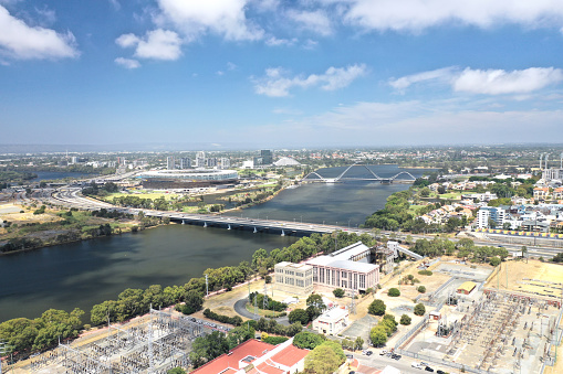 Perth, Western Australia - February 28, 2019: Abandoned East Perth power station (aerial view) prior to proposed redevelopment with Swan River, Matagarup Bridge, Perth Stadium and WACA in background