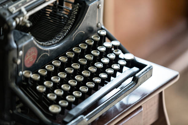 Old-Fashioned Manual Typewriter Alphabet Letter Keys Old-fashioned manual typewriter with capital alphabet letters on the round keys in the now-universal QWERTY format. typewriter writing retro revival work tool stock pictures, royalty-free photos & images