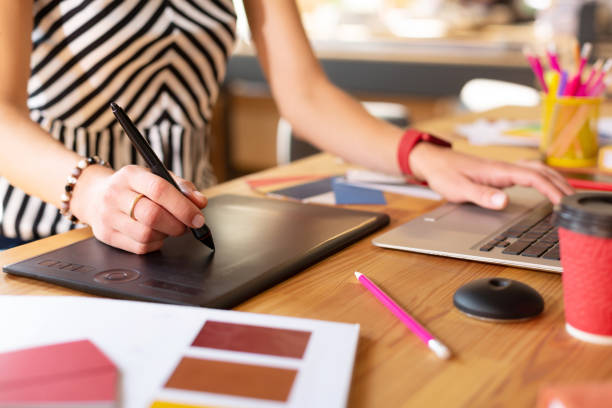 istock Creative manager wearing smart watch working hard 1168517446
