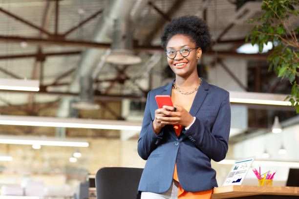 istock Woman holding red smartphone while texting boyfriend 1168517574