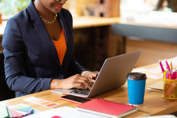 istock Interior designer drinking coffee and working on laptop 1168517636