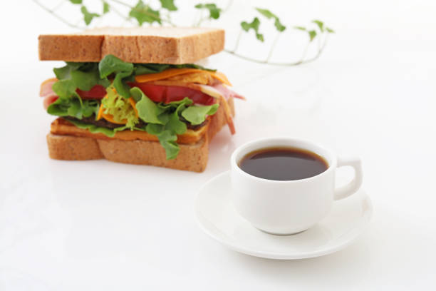 Tasty sandwiches and a cup of coffee on the table