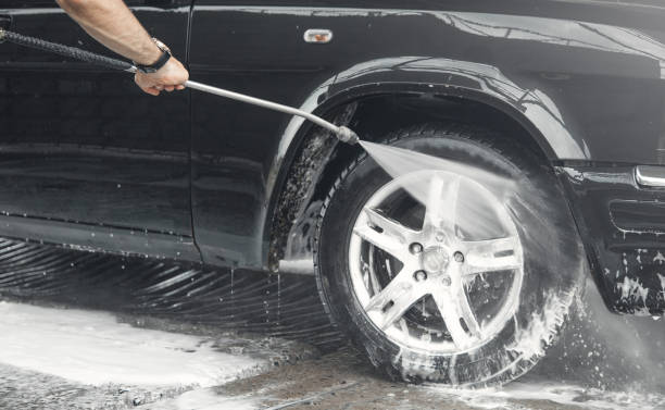 istock Car washing. The washing process on a self service car wash 1168520391