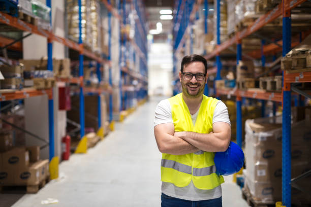 warehouse worker. smiling worker in distribution center. - warehouse worker imagens e fotografias de stock