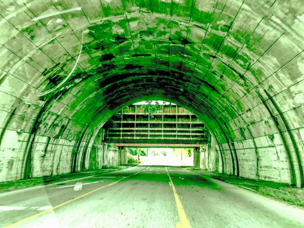 POV Car driving inside a Road Tunnel n the Canadian Rockies During Summer, Canada
