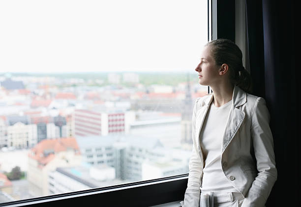 istock buisnesswoman at the window 116853044