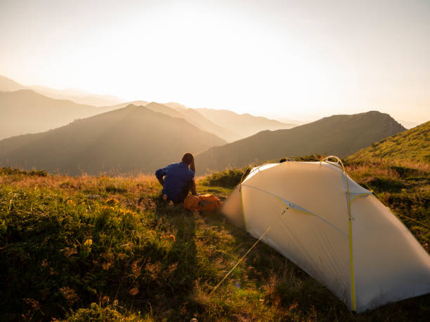 istock Hiker resting around his tent in the mountain. 1168532042