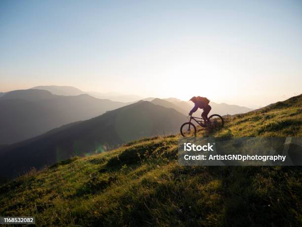 Mountain Biker Riding Downhill Stock Photo - Download Image Now - Cycling, Mountain Bike, Mountain Biking