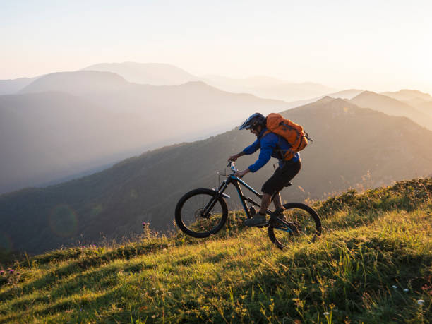 istock Mountain biker riding downhill on back tire. 1168532093