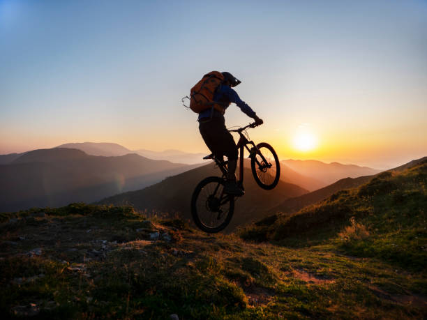 istock Mountain biker riding downhill in mountain. 1168532115